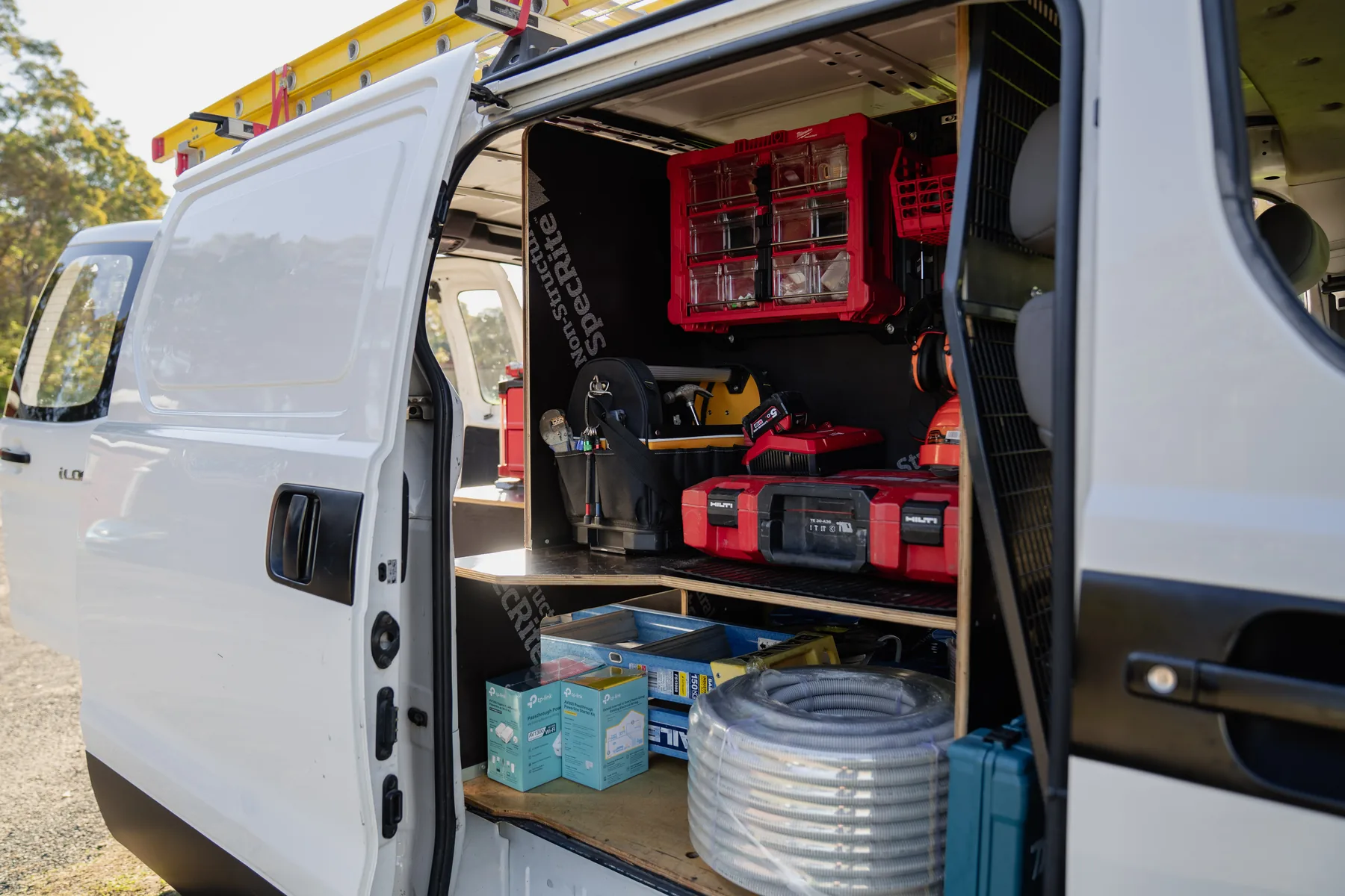 Van with rear doors open showing a completed Vanworks fitout